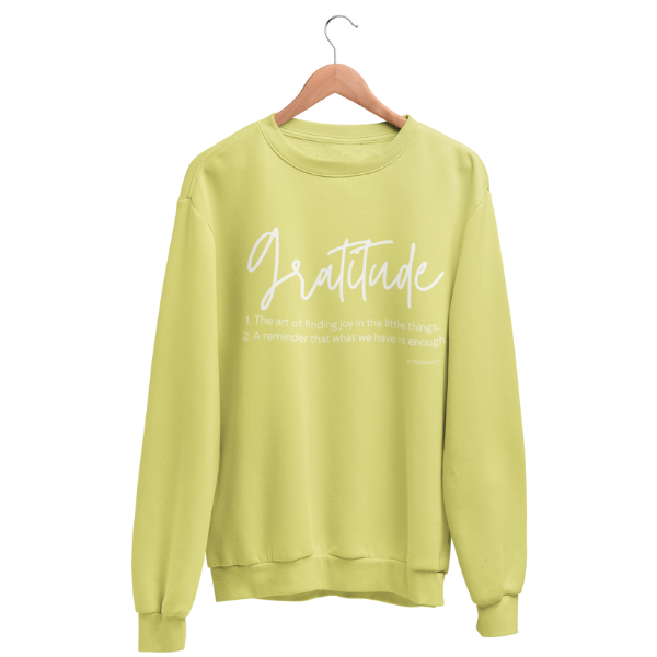 Cozy gratitude sweatshirt with hand-lettered “Gratitude” definition graphic, part of a charity collection that provides 50 meals for U.S. Veterans.
