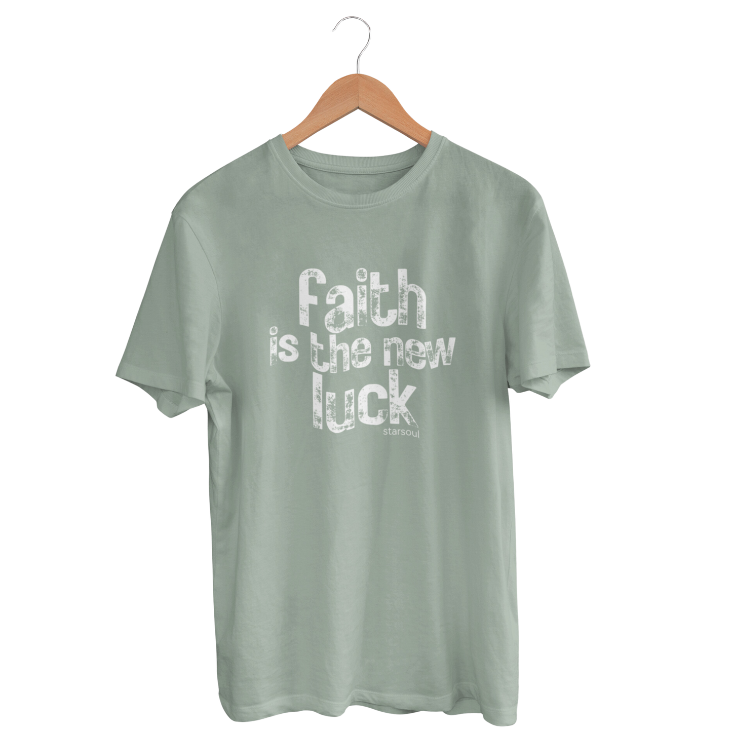 A sage green crew neck t-shirt with the text 'faith is the new luck' printed on the front in white distressed font. unisex