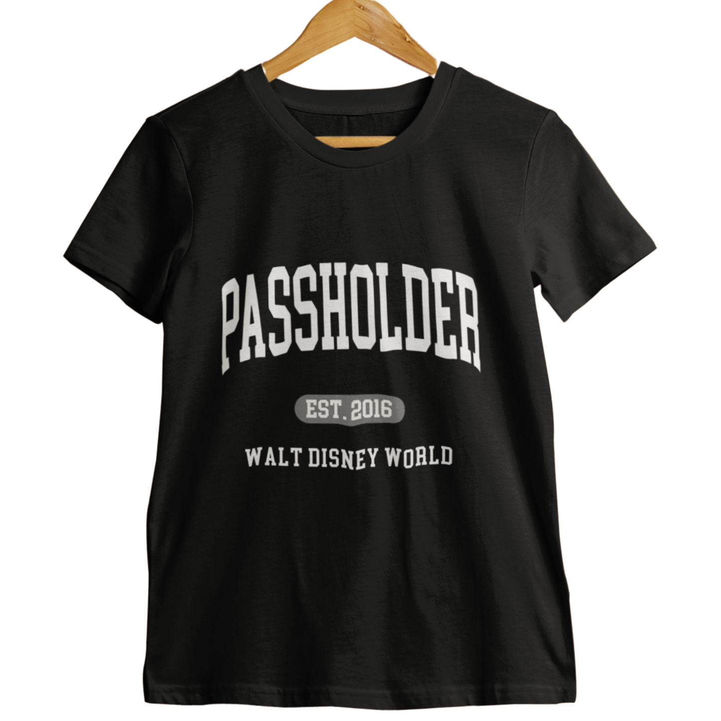 Black Walt Disney World Passholder t-shirt with “Passholder Est. 2016 Walt Disney World” printed in white letters, displayed on a wooden hanger.