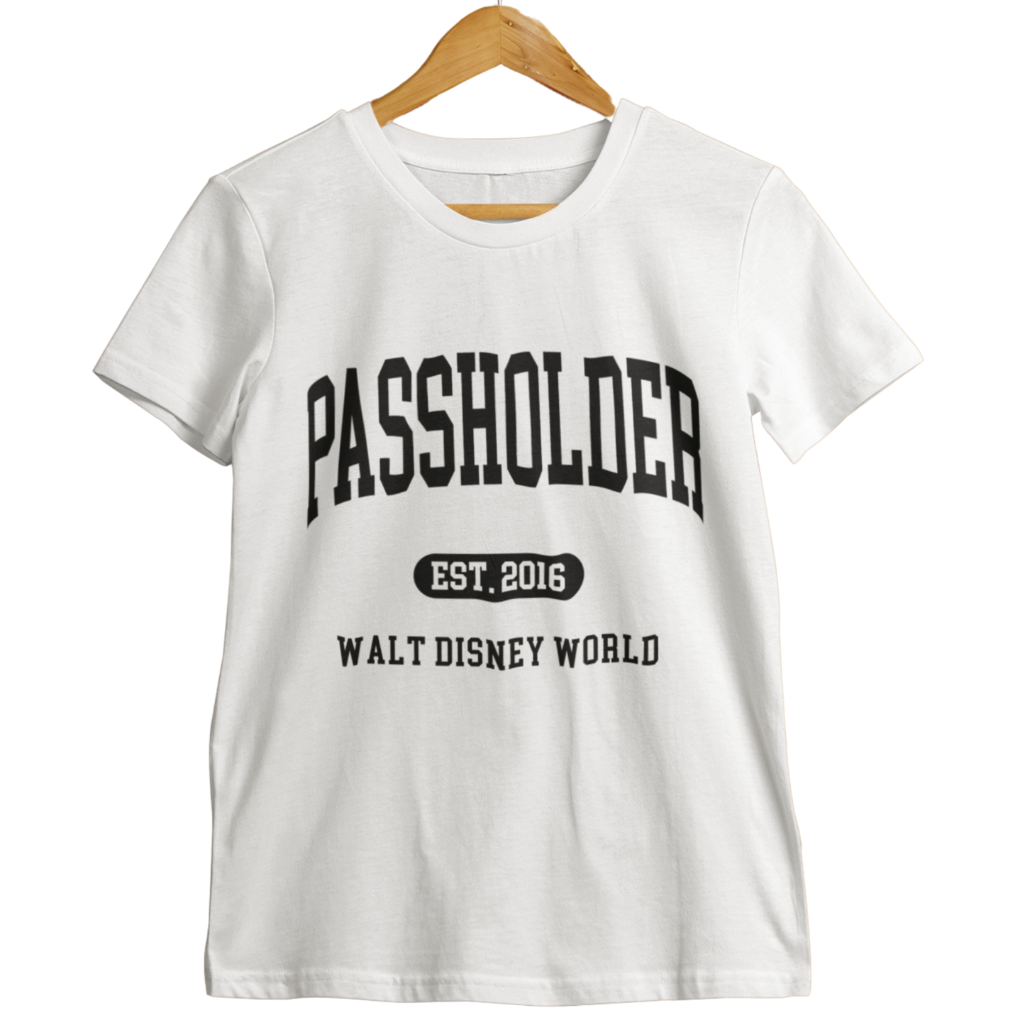 White Walt Disney World Passholder t-shirt with “Passholder Est. 2016 Walt Disney World” printed in black letters, displayed on a wooden hanger.