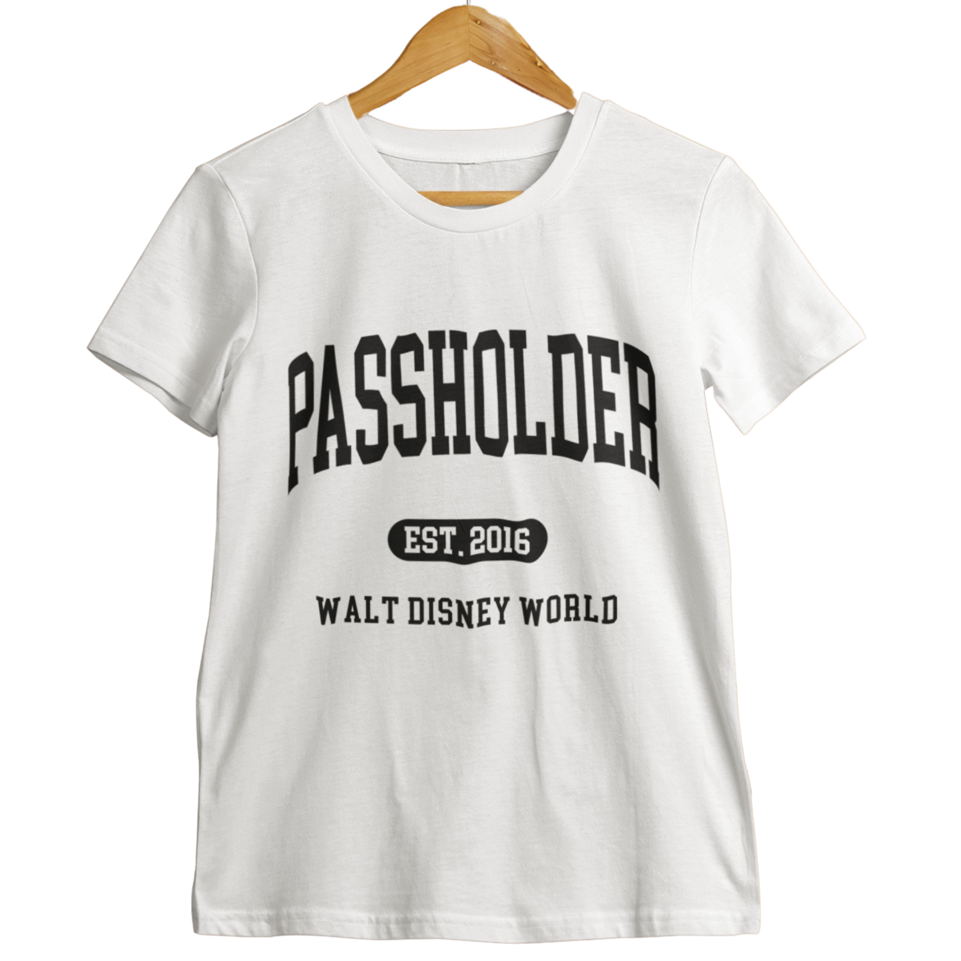 White Walt Disney World Passholder t-shirt with “Passholder Est. 2016 Walt Disney World” printed in black letters, displayed on a wooden hanger.
