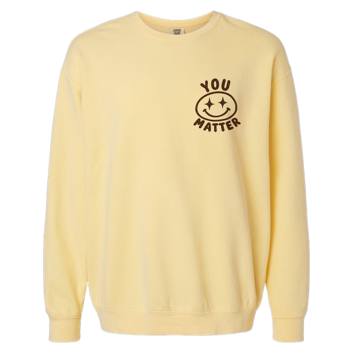 A pale yellow crewneck sweatshirt with a brown graphic on the left chest featuring a smiley face and the words 'YOU MATTER'.