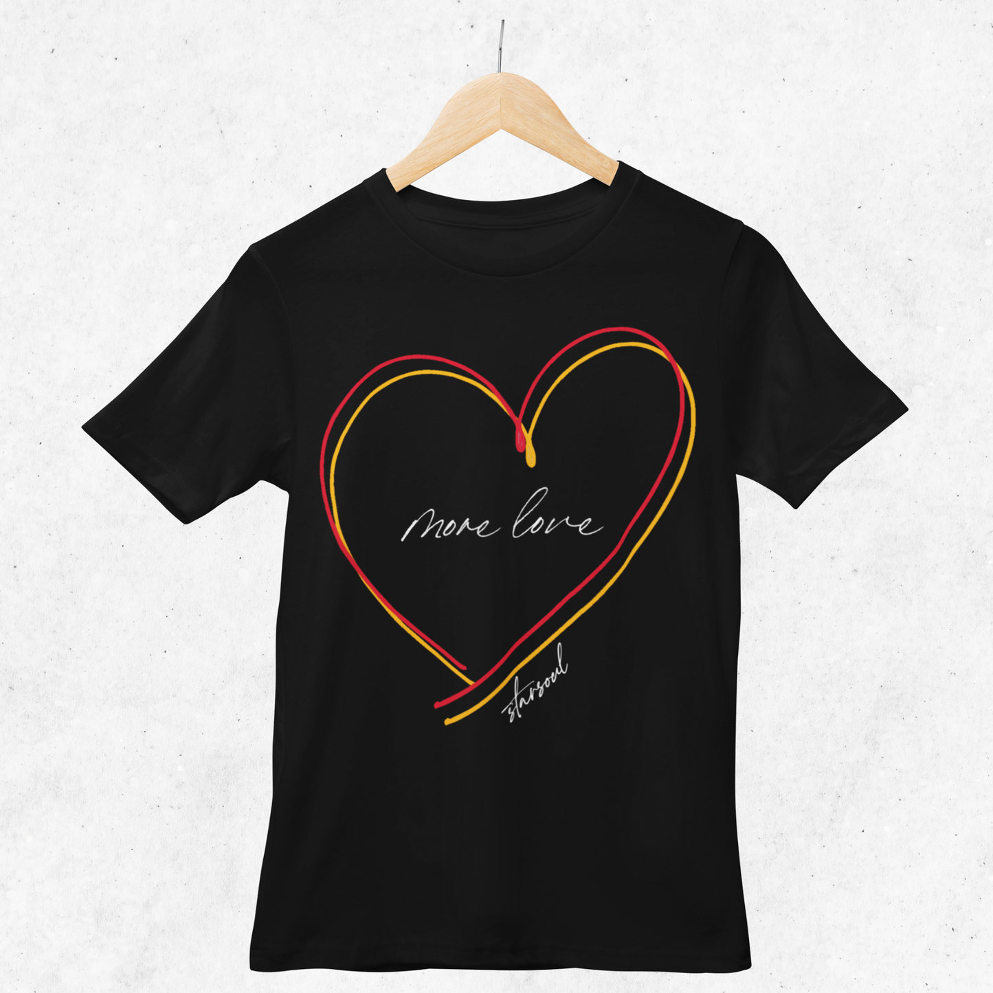 black shirt with yellow and red heart (text: more love).Every purchase from the #KCstrong collection donates 100% of the proceeds to the Kansas City Strong emergency fund created by the Chiefs and the United Way of Kansas City.
