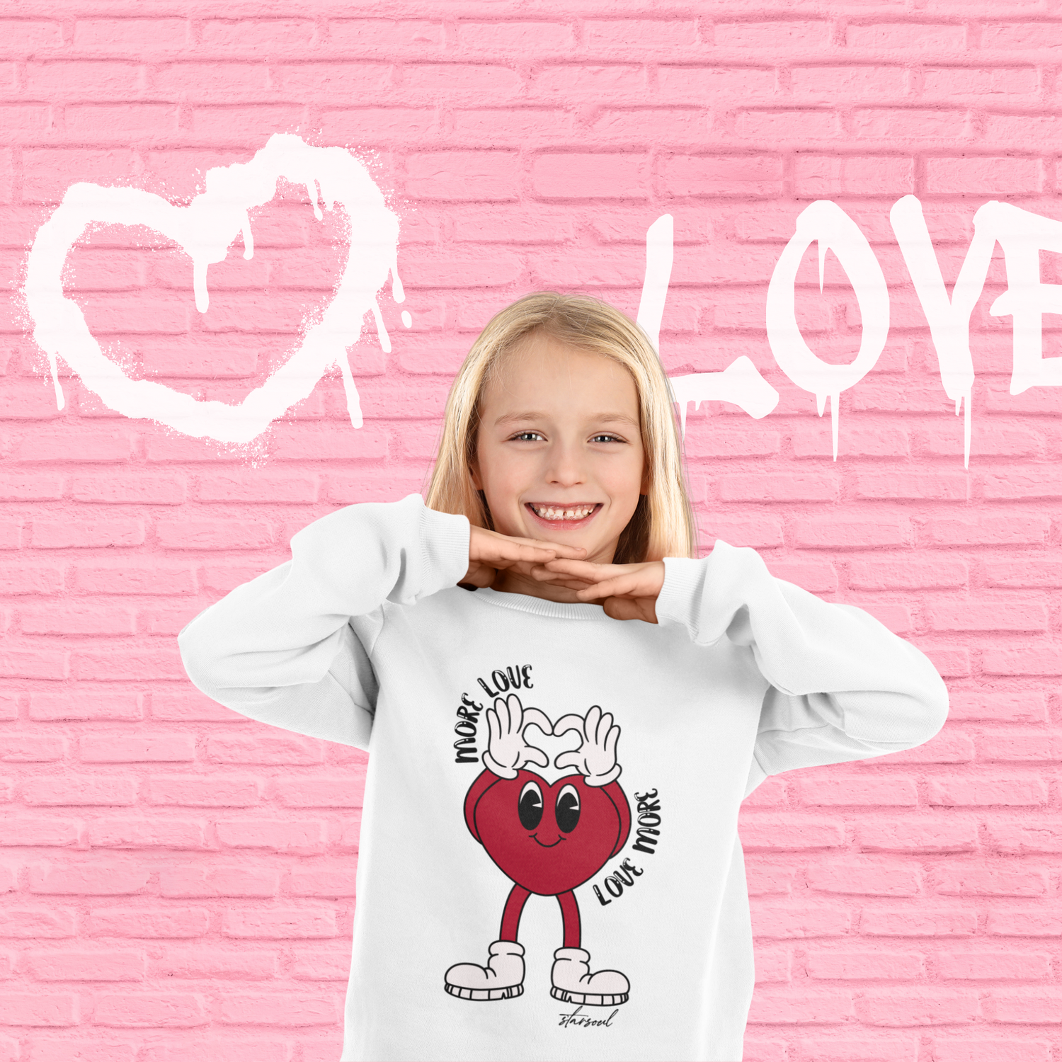 white sweatshirt with heart character "more love" "love more" design benefitting heart disease