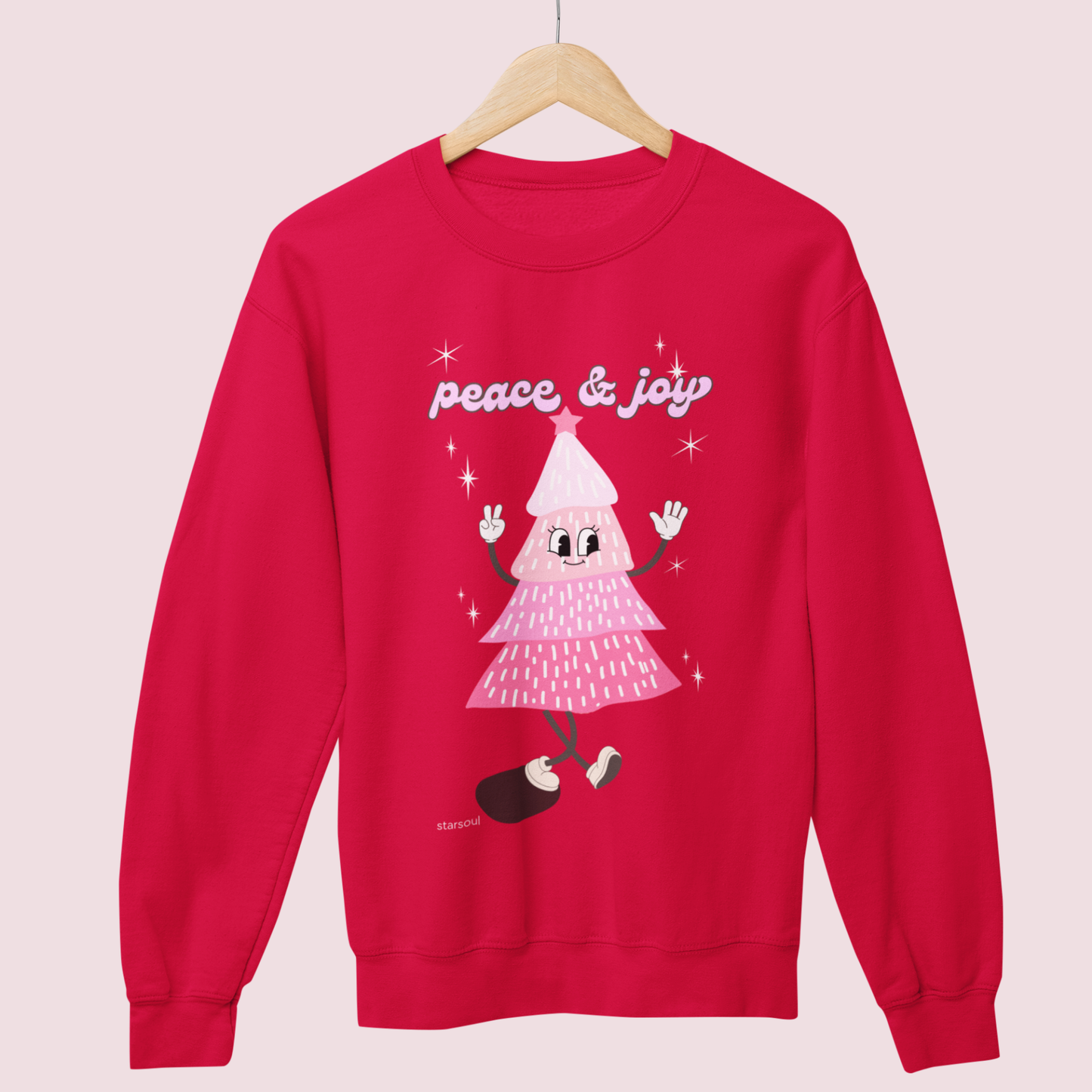 The Holiday Collection donates all proceeds to programs gifting toys to underprivileged kids through out the season. Shop and give back, and be merry! Red and pink christmas tree sweater