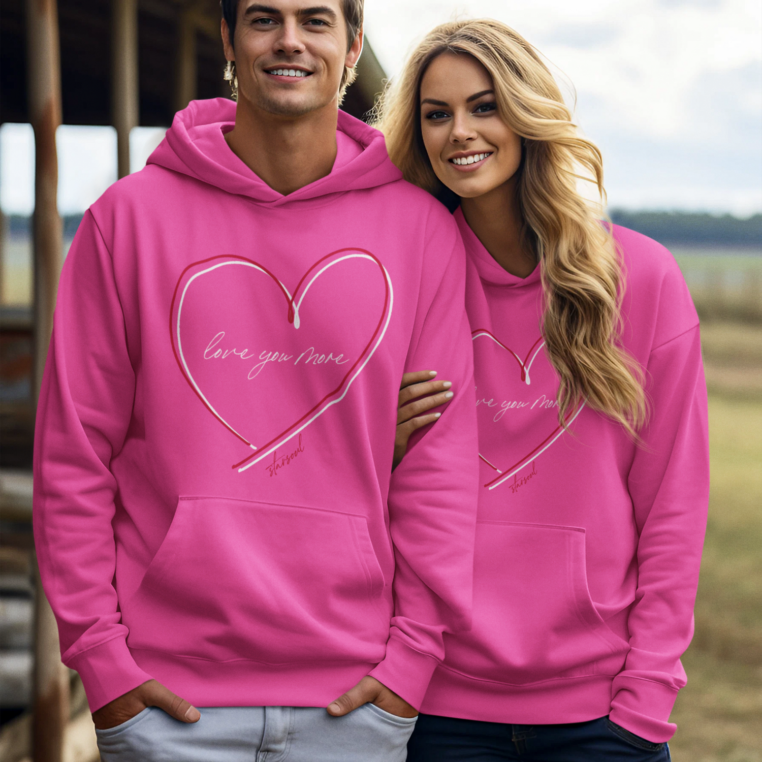bright pink hoodie, with double red and white hearts and "love you more" benefitting heart disease