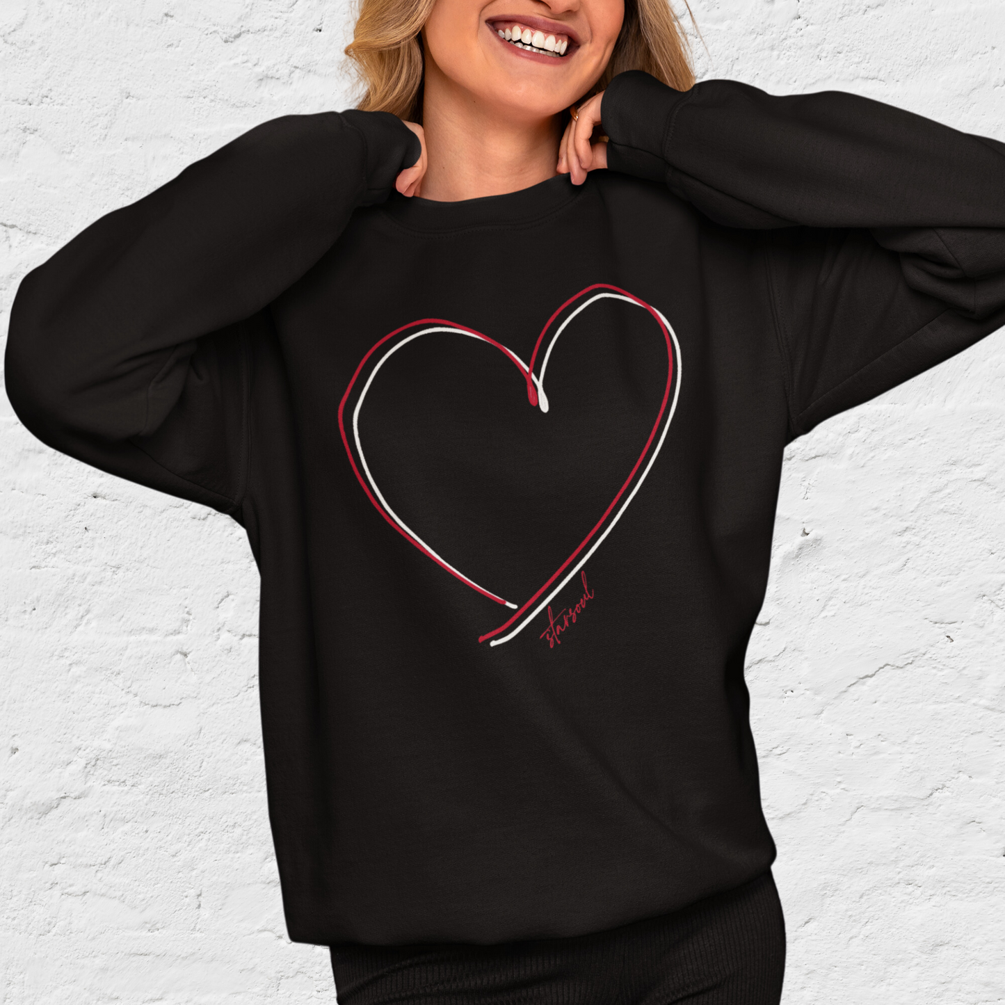 black sweatshirt with double red white heart design benefitting heart disease