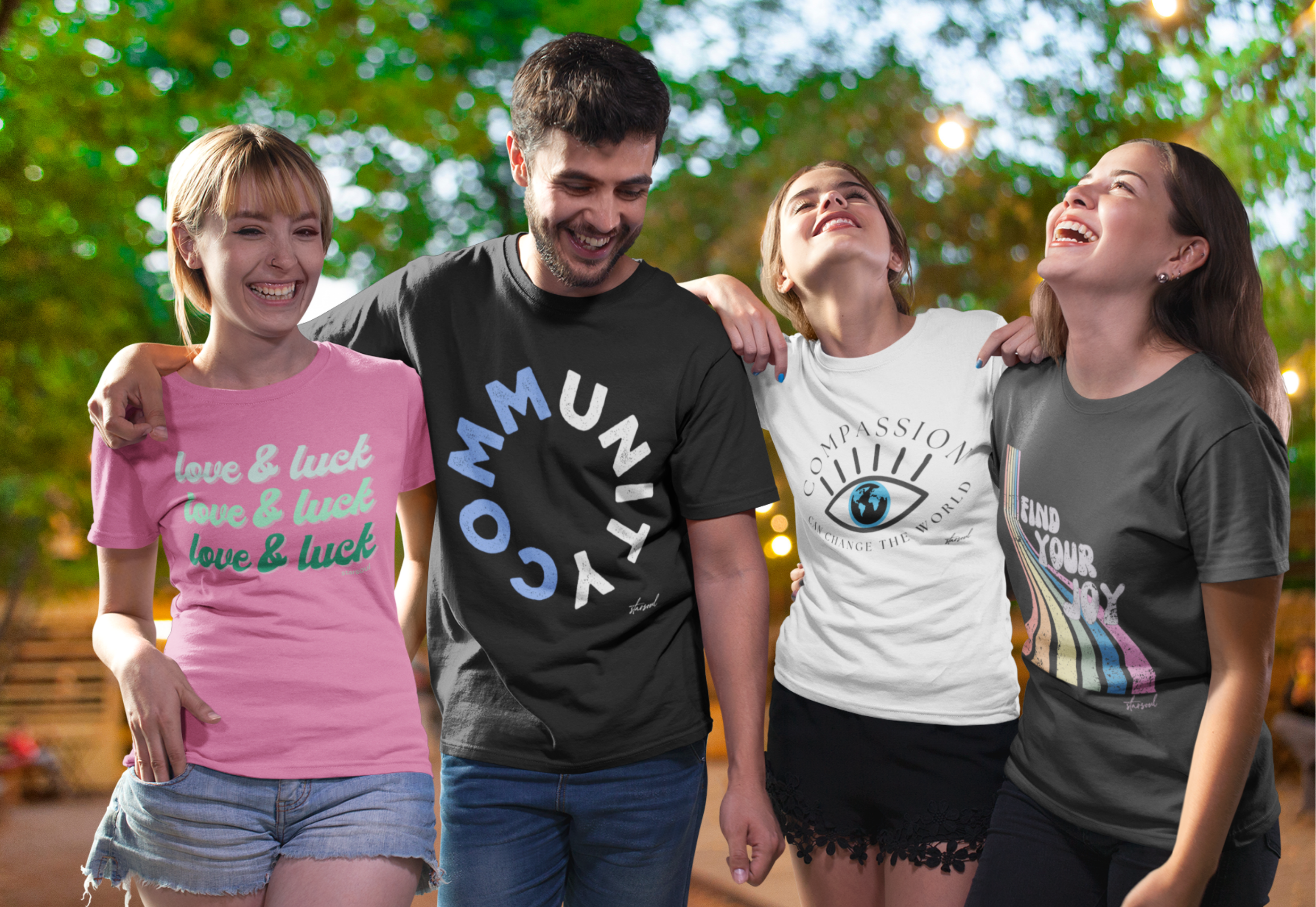 Four people wearing colorful charity t-shirts t-shirts with various designs.
