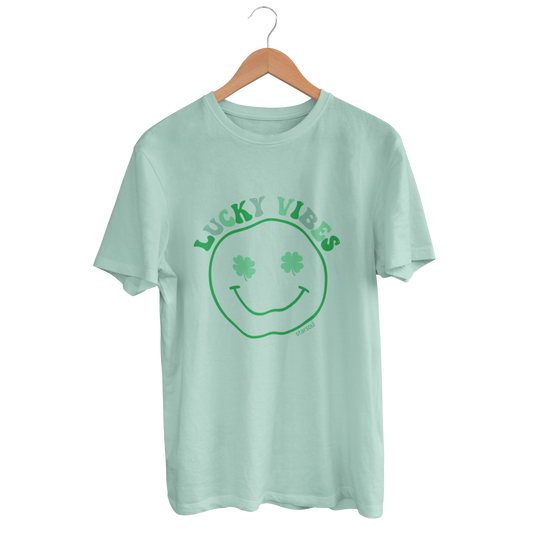 mint t-shirt with lucky vibes printed featuring smiley face and clover eyes all proceeds go to supporting moms in need charity