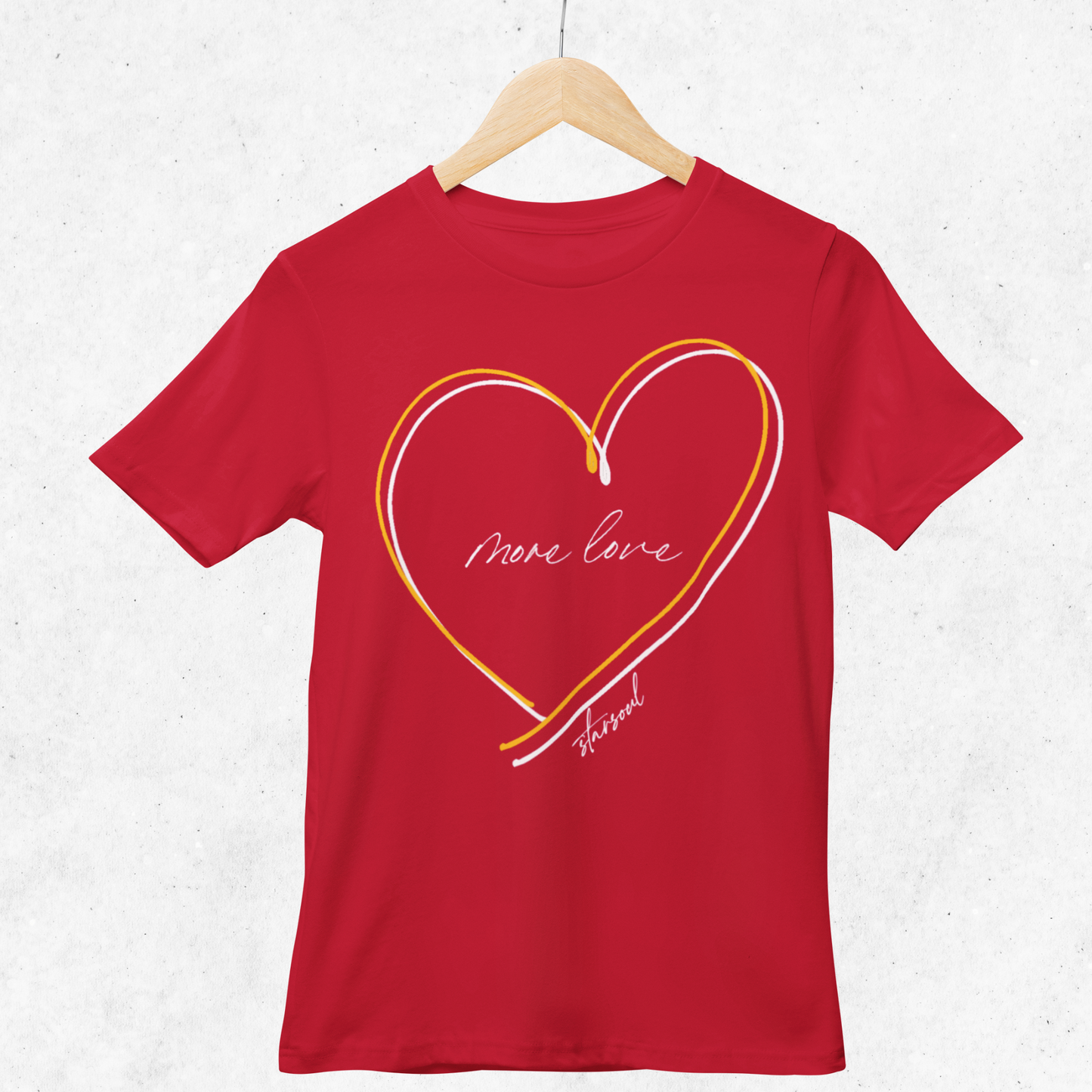 red shirt with yellow and white heart (text: more love).Every purchase from the #KCstrong collection donates 100% of the proceeds to the Kansas City Strong emergency fund created by the Chiefs and the United Way of Kansas City.